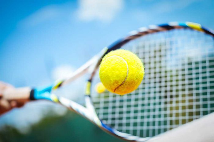 tennis-ball-and-racket-istock-480440650